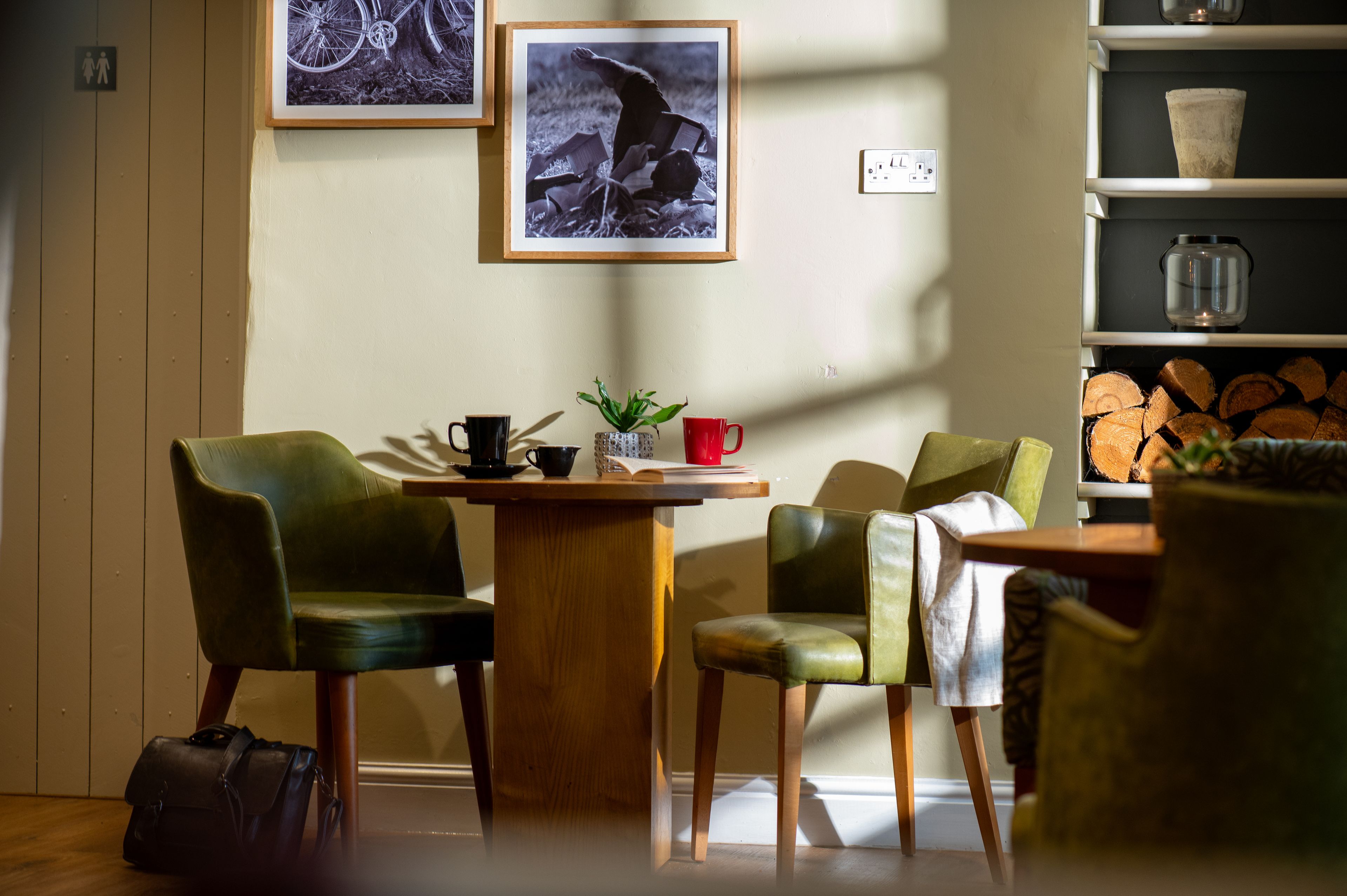 Table for two with two coffee mugs and a book