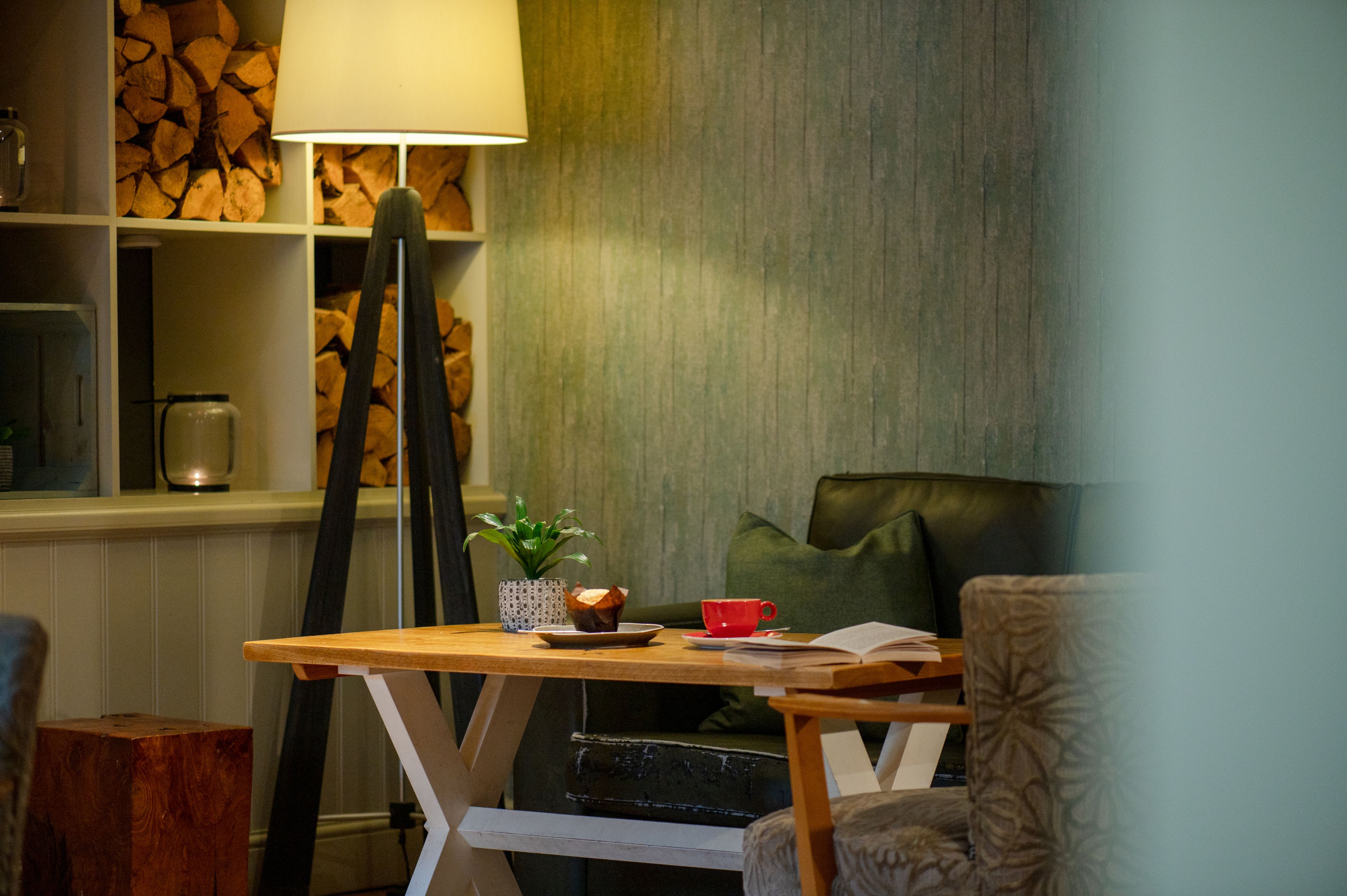 Close up of coffee table with floor lamp turned on